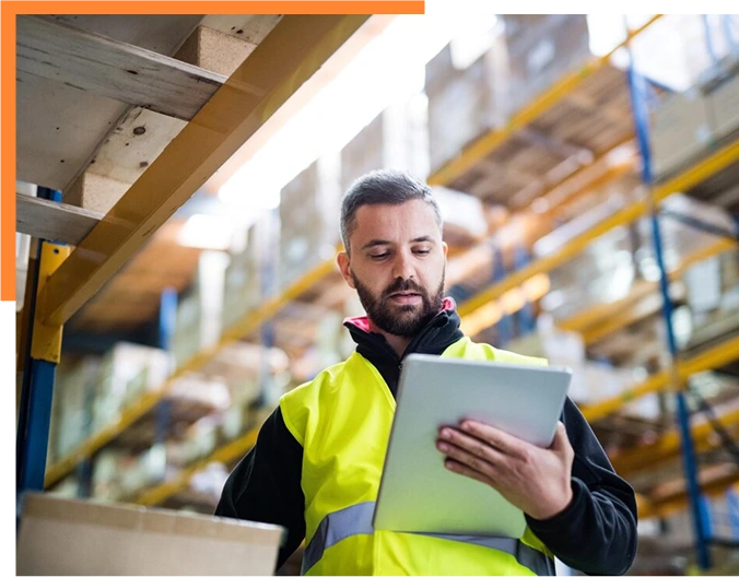 Male warehouse worker with tablet