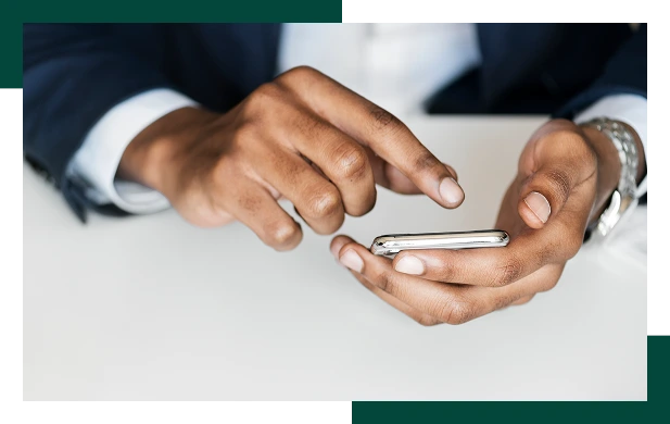 Closeup of businessman using mobile phone