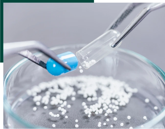 Pharmaceutical Worker Examining a Pill