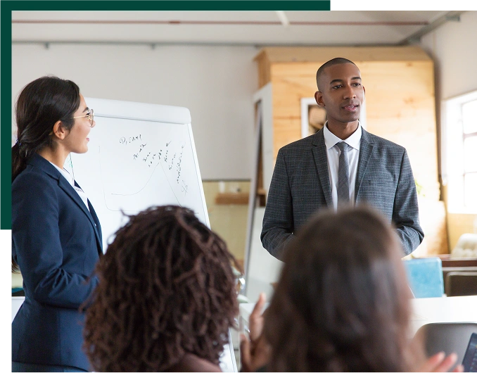 Cheerful young speakers standing near whiteboard