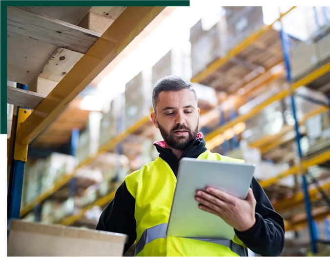 Male warehouse worker with tablet